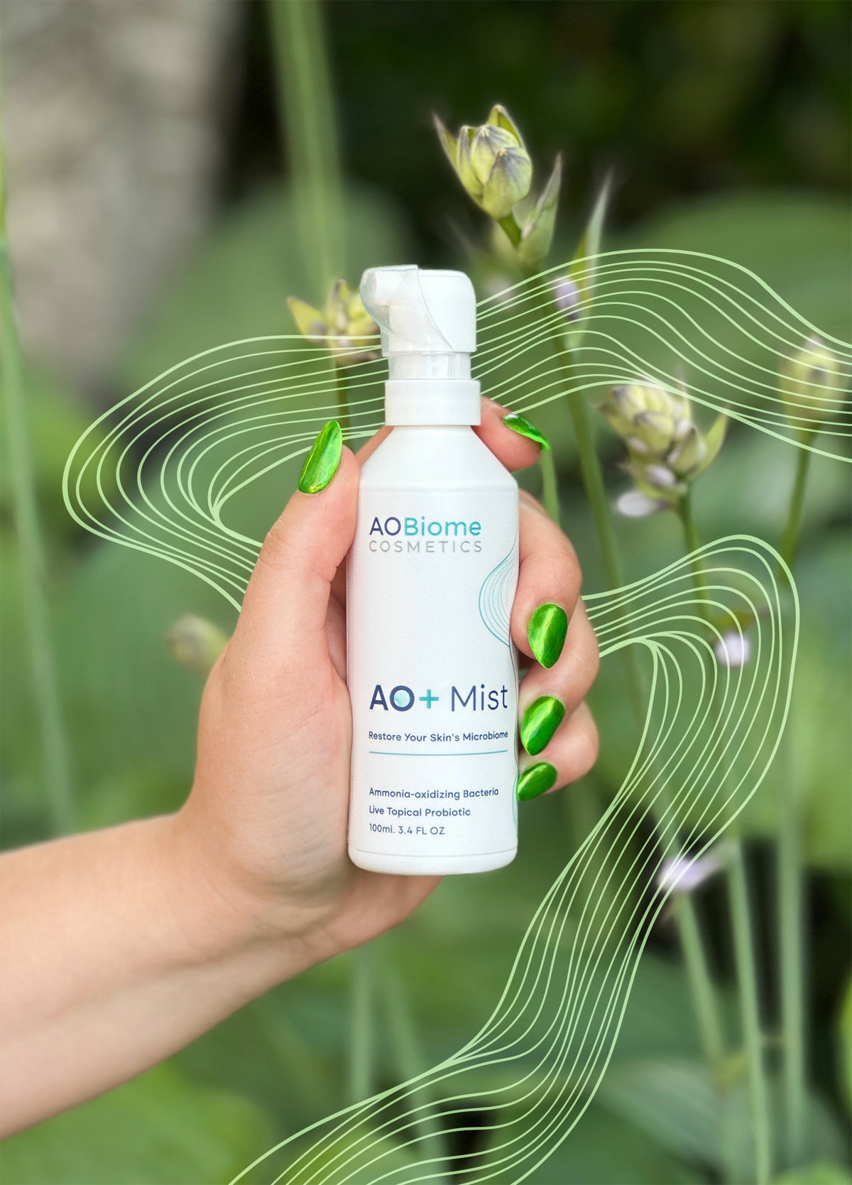 Hand holding a bottle of AO+ Mist against a background of leaves and flower buds