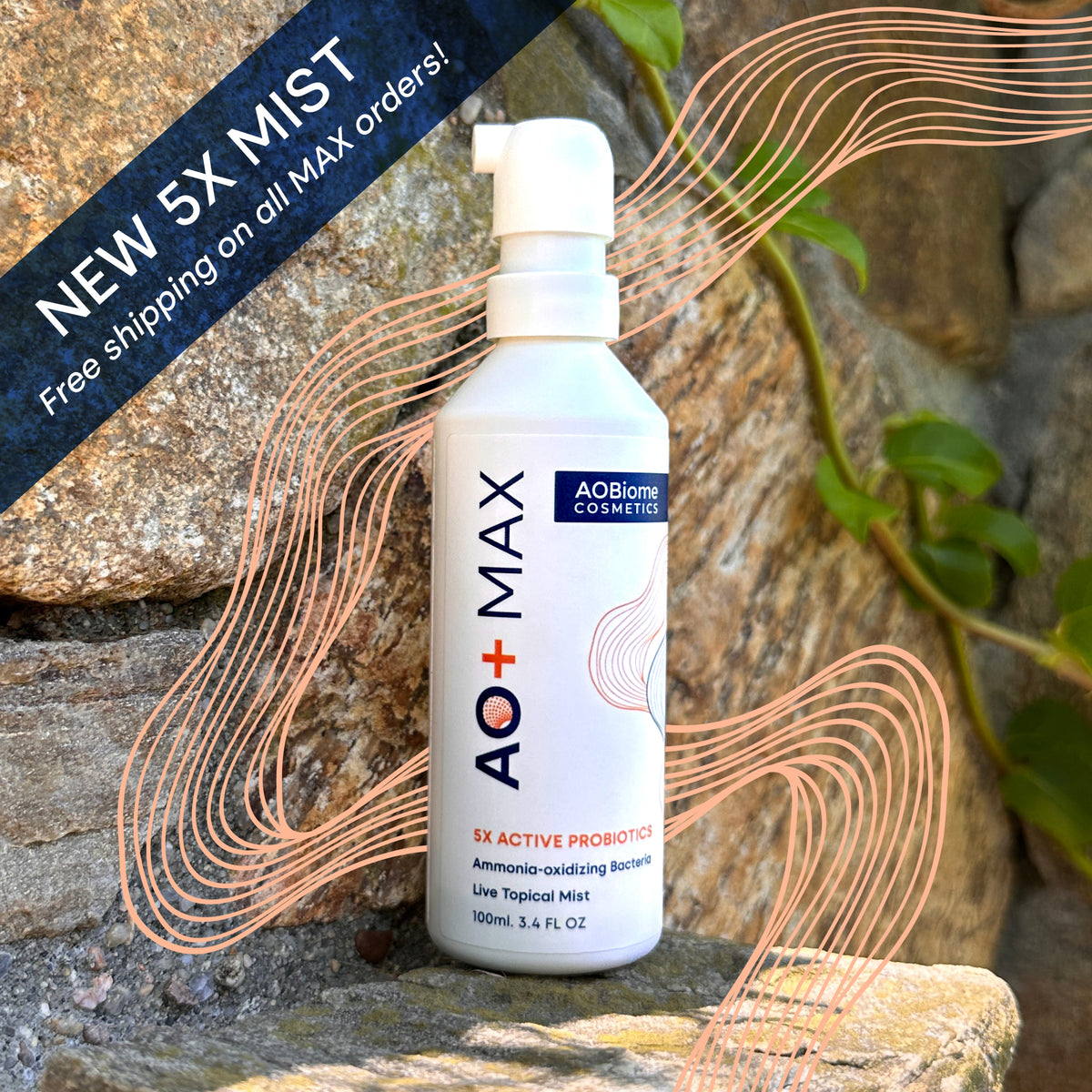 A white pump bottle of AO+ MAX probiotic powder stands on a stone surface outdoors against a rock wall with green ivy